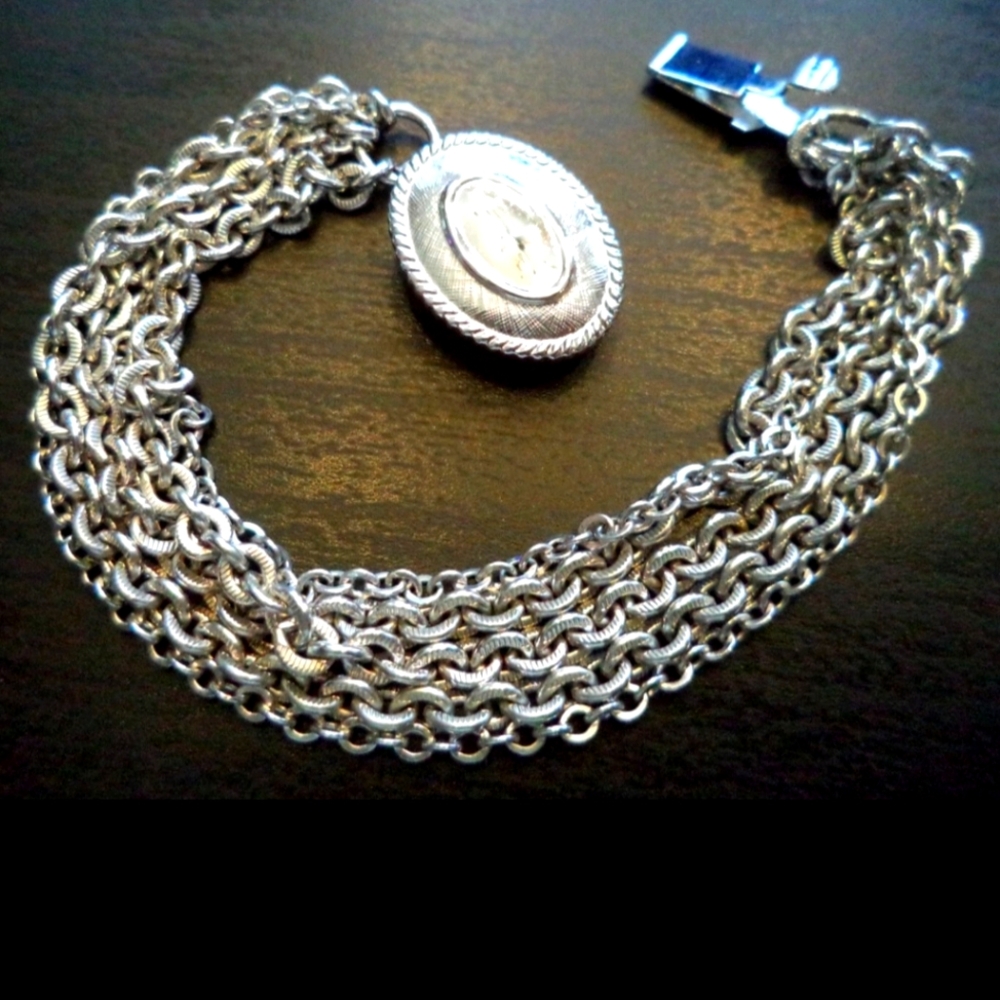 AVON SILVER TONE BRACELET
